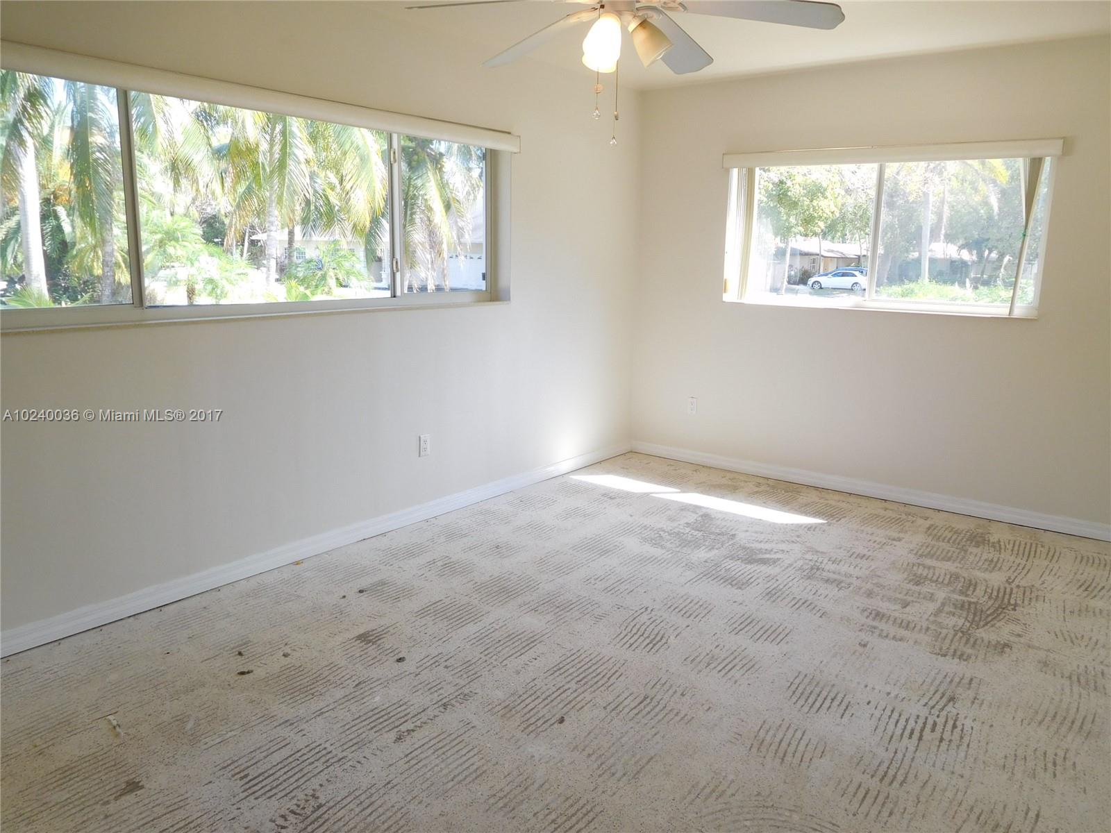 14441 Snapper Drive Coral Gables, FL 33158 - Photo 14 of 27 an empty room with a window