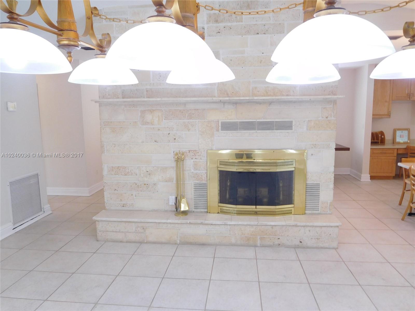 14441 Snapper Drive Coral Gables, FL 33158 - Photo 15 of 27 a view of fireplace and living room