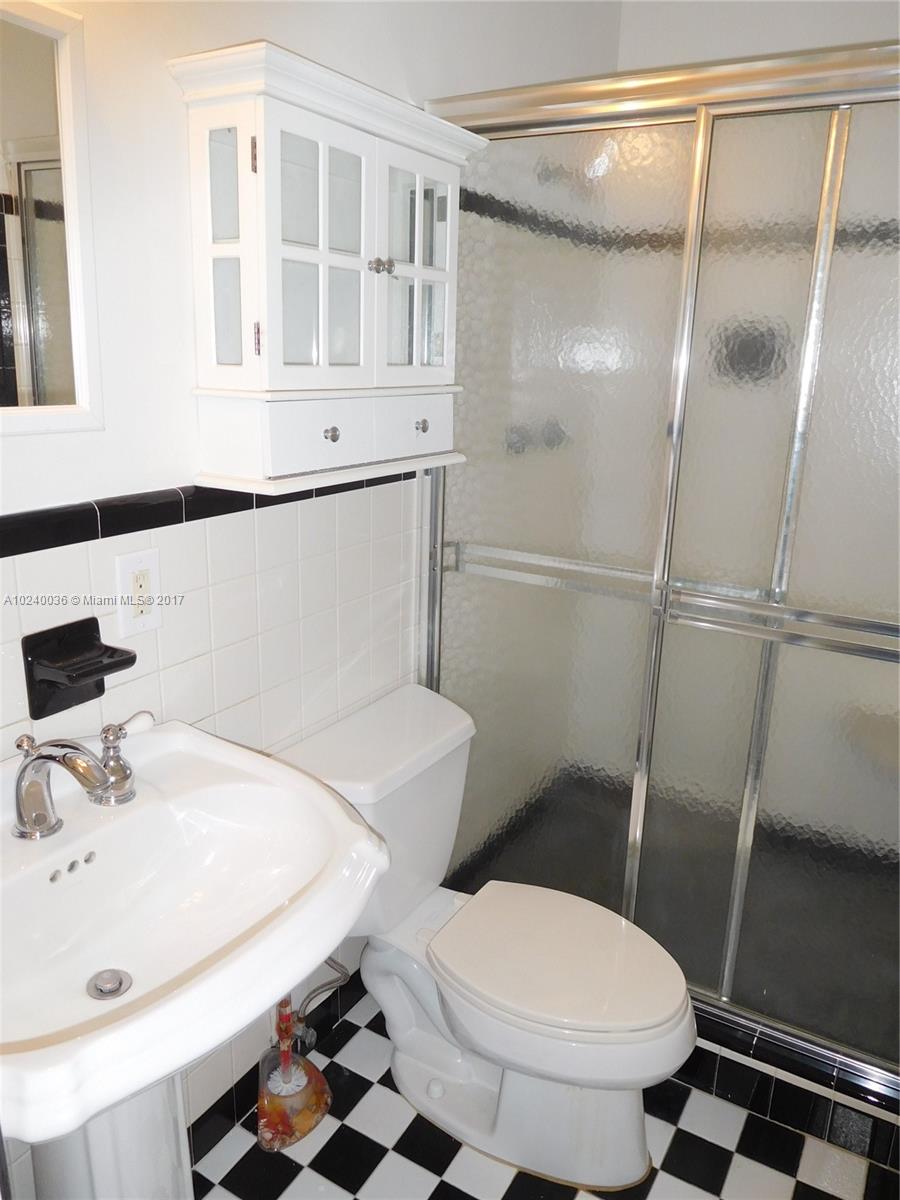 14441 Snapper Drive Coral Gables, FL 33158 - Photo 18 of 27 a bathroom with a sink toilet and shower