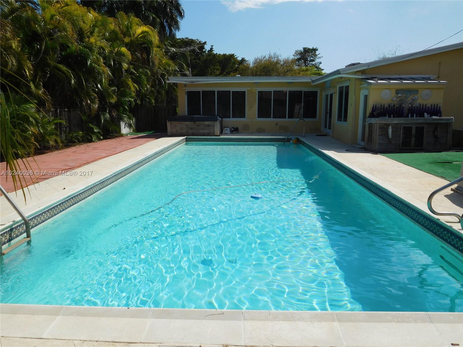 14441 Snapper Drive Coral Gables, FL 33158 - Photo 22 of 27 a view of a house with a yard
