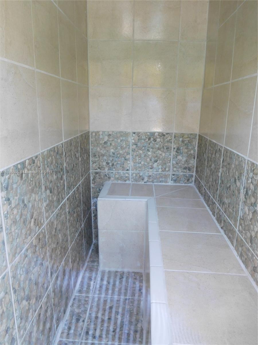 14441 Snapper Drive Coral Gables, FL 33158 - Photo 24 of 27 a bathroom with a shower