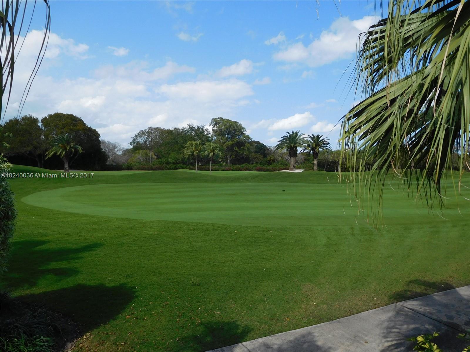 14441 Snapper Drive Coral Gables, FL 33158 - Photo 26 of 27 a view of a golf course with a garden