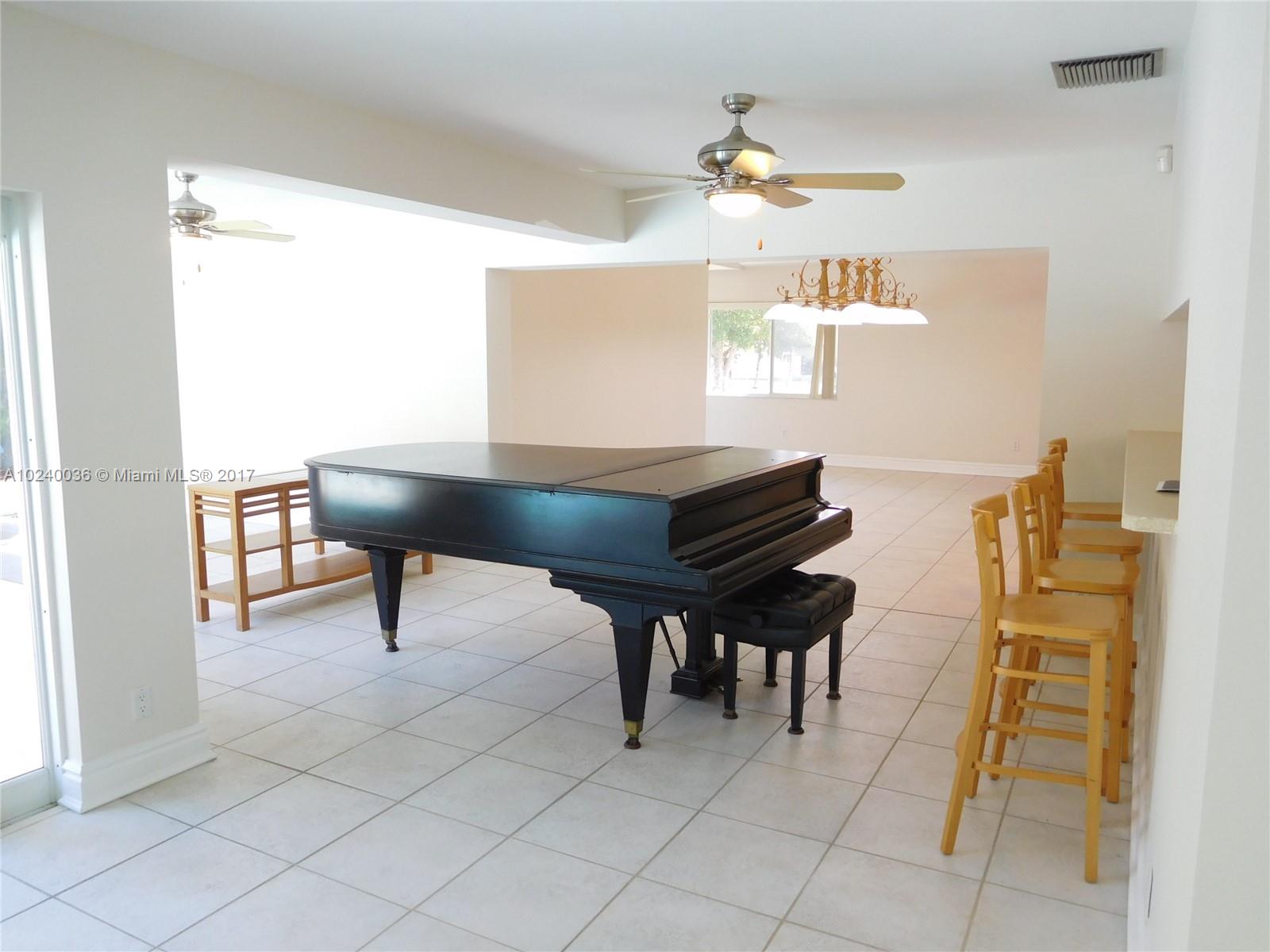 14441 Snapper Drive Coral Gables, FL 33158 - Photo 6 of 27 a view of a workspace with furniture