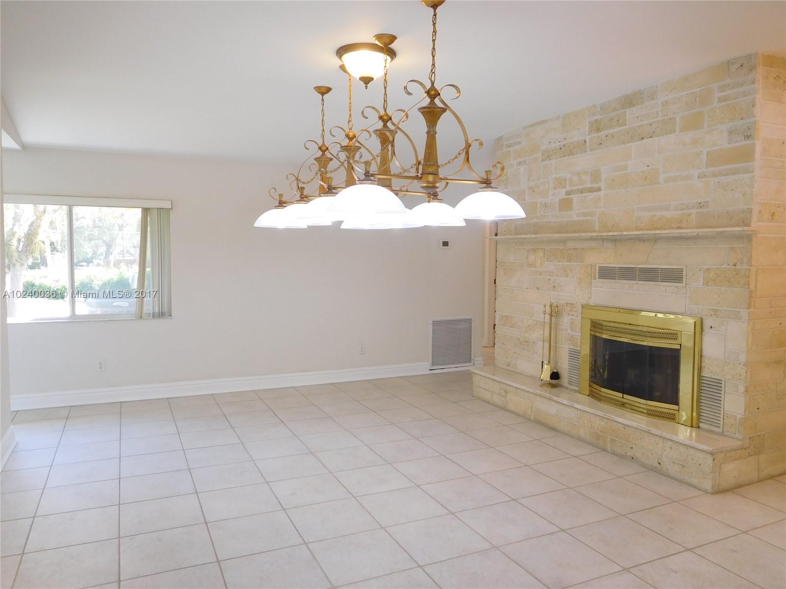 14441 Snapper Drive Coral Gables, FL 33158 - Photo 8 of 27 an empty room with fireplace