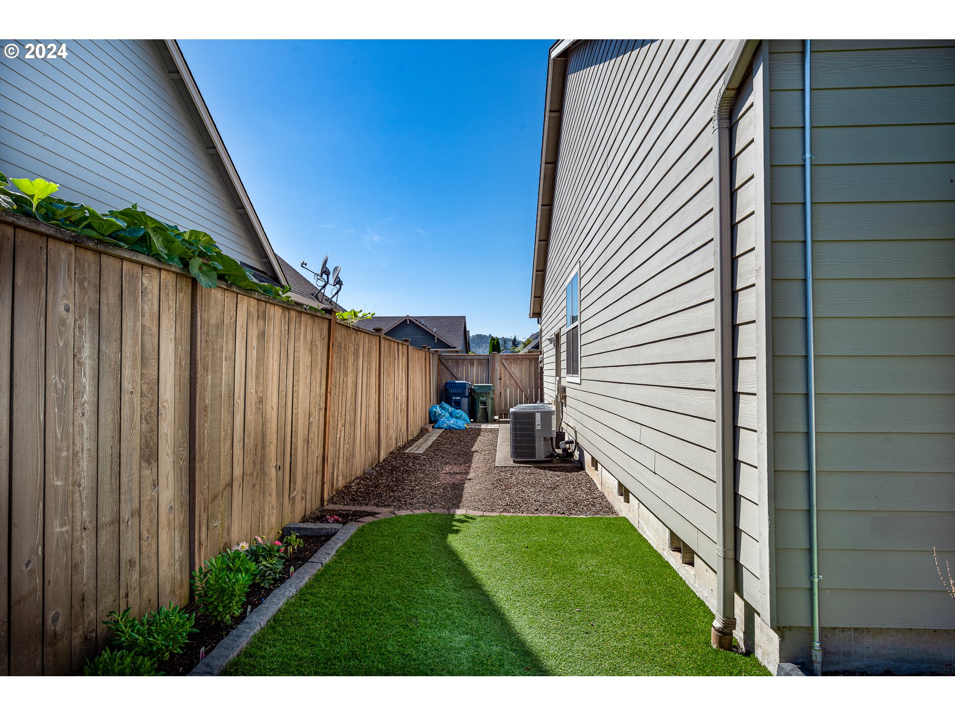 1181 South 41st Street Springfield, OR 97478 - Photo 39 of 39 a view of backyard with potted plants and wooden fence