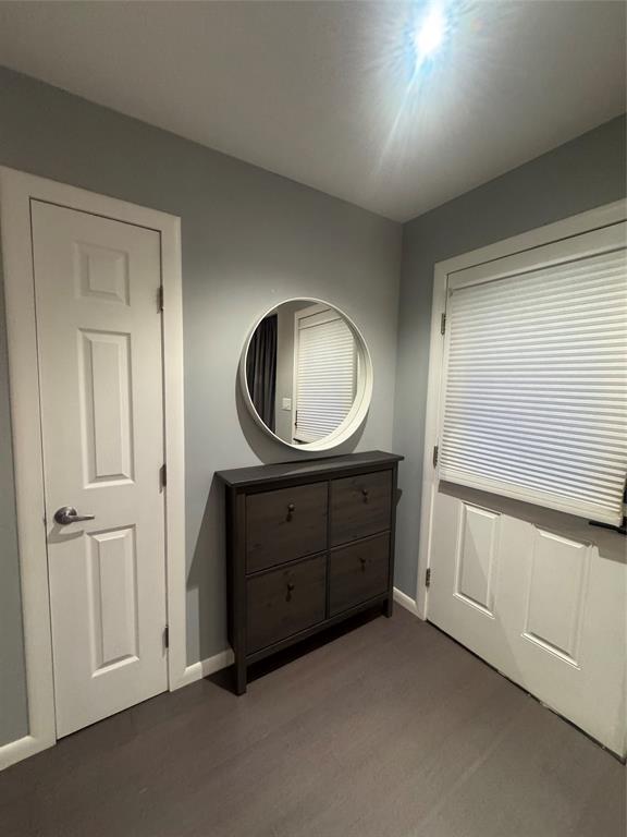 708 West 1st Street Hico, TX 76457 - Photo 5 of 24 a room with a mirror and a dresser