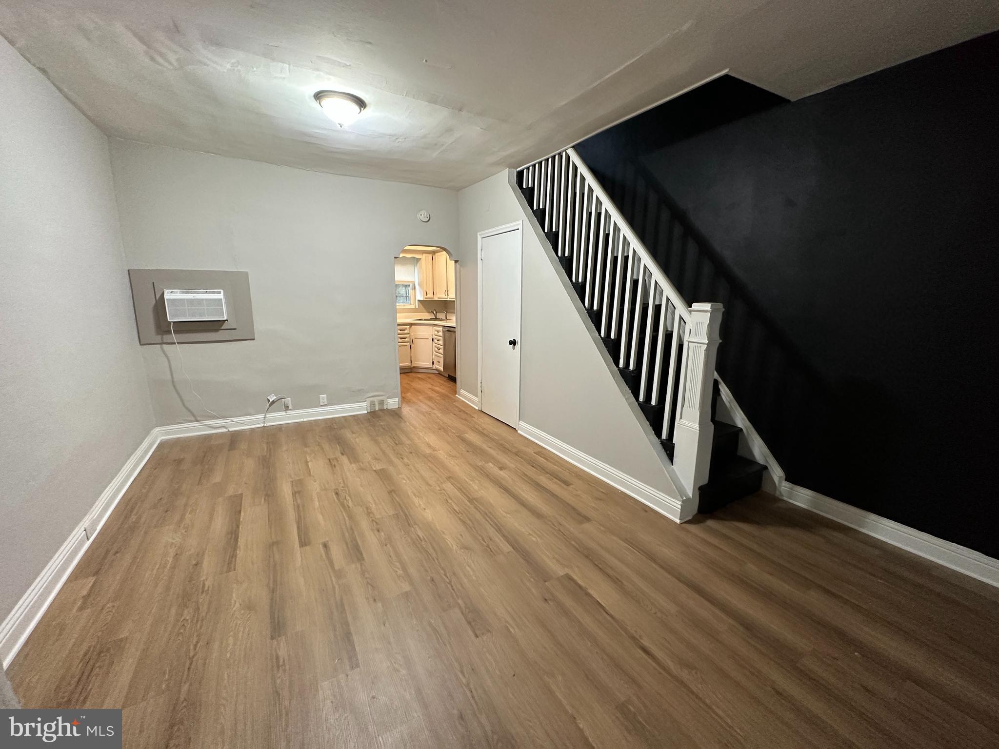 1909 South Hemberger Street Philadelphia, PA 19145 - Photo 5 of 12 a view of a hallway with wooden floor and staircase