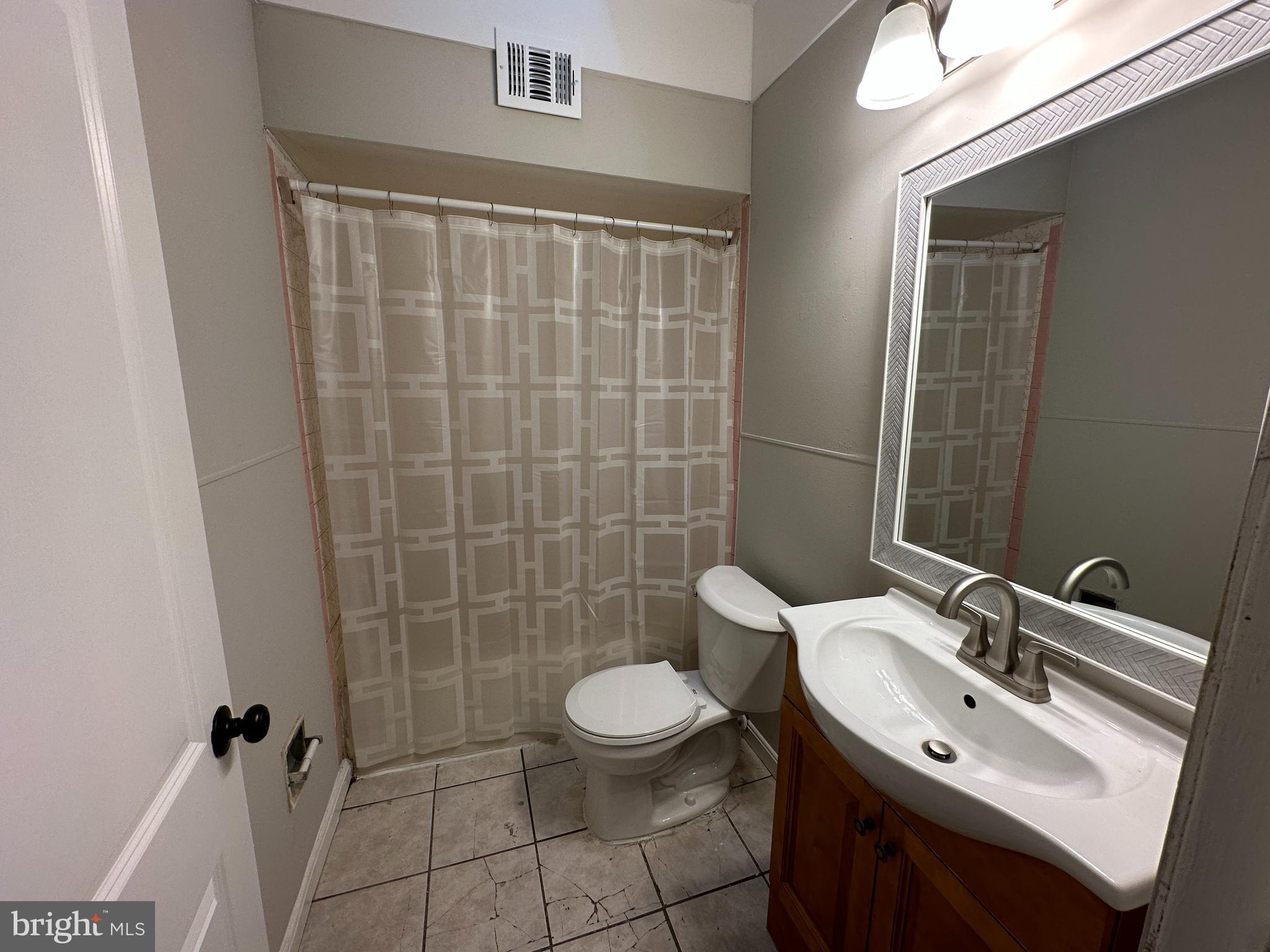 1909 South Hemberger Street Philadelphia, PA 19145 - Photo 7 of 12 a bathroom with a sink a toilet and shower