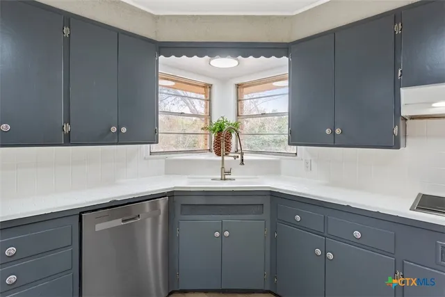 a living room with a bed furniture and a window