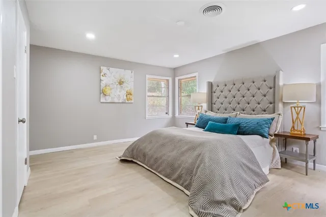 a bedroom with a large bed