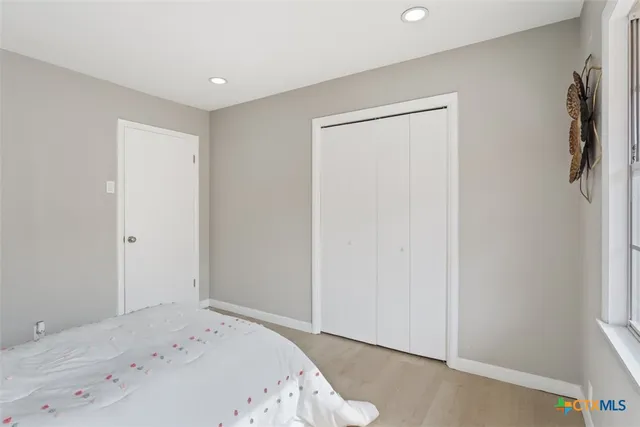 a bathroom with a sink vanity granite and a mirror