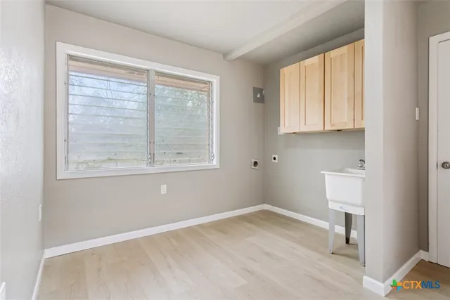 a view of house with backyard and seating space