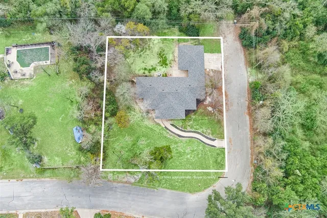 a view of a brick house with a window