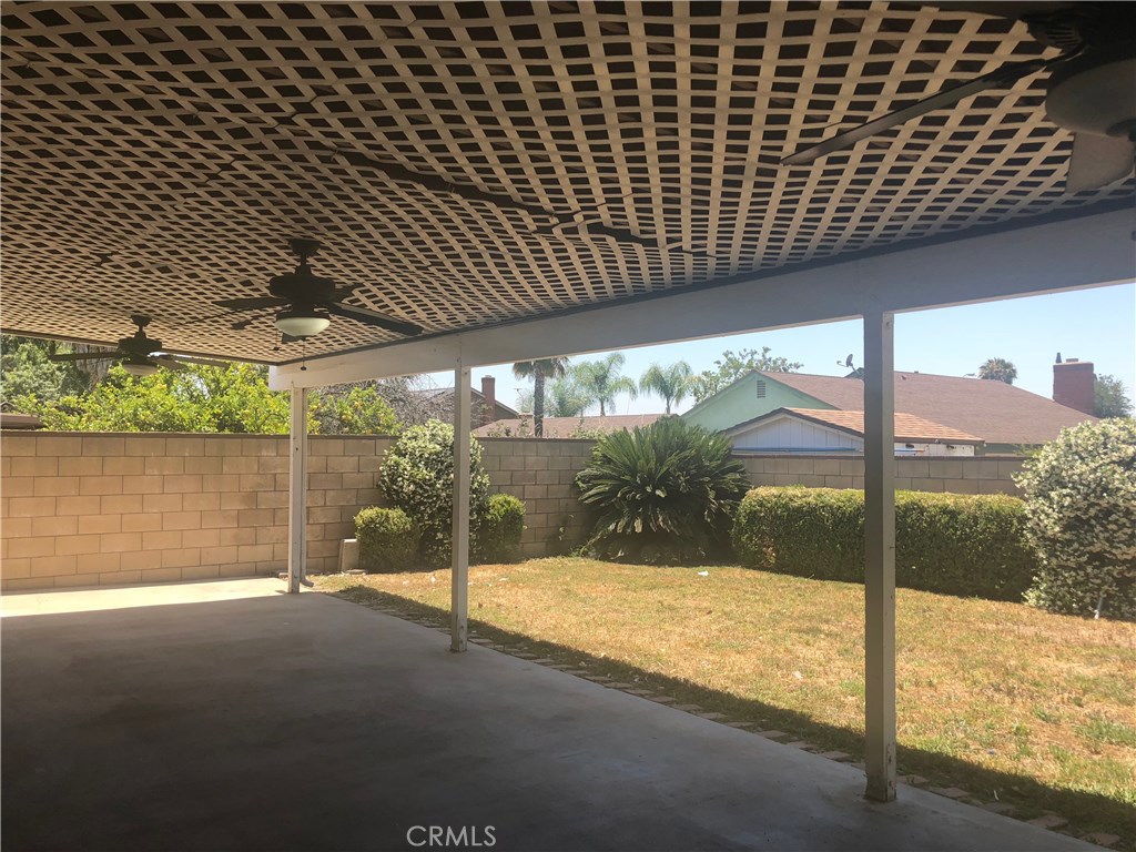 9150 Malachite Avenue Rancho Cucamonga, CA 91730 - Photo 3 of 9 a view of a porch with a table