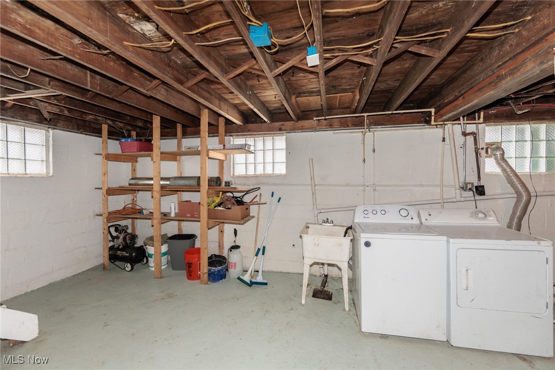 5062 Lee Road Maple Heights, OH 44137 - Photo 27 of 50 Below grade area featuring healthy amount of natural light and washer and dryer