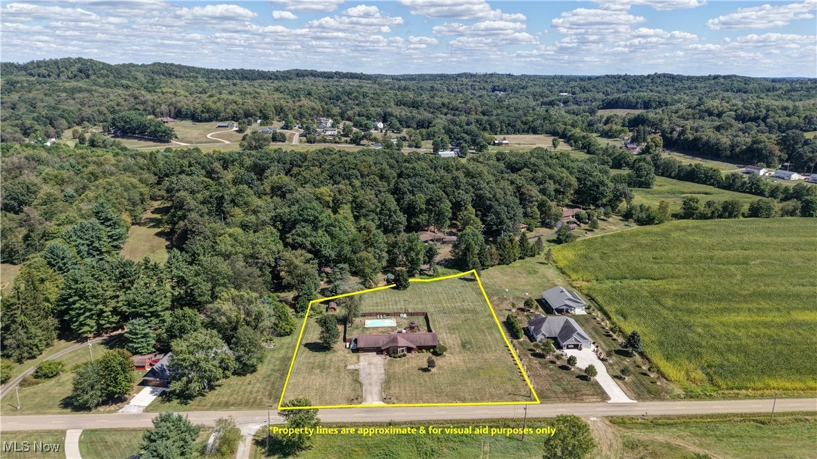 5747 Middle Run Road Dover, OH 44622 - Photo 2 of 30 Overview of rural landscape with a forest and property parcel outlined