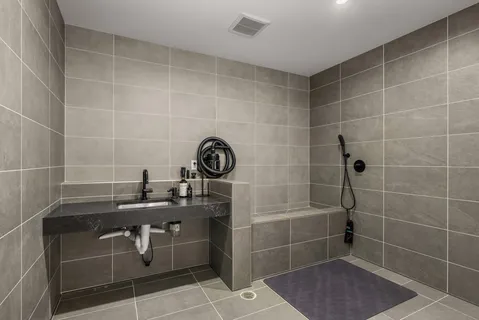 a large kitchen with a table and chairs