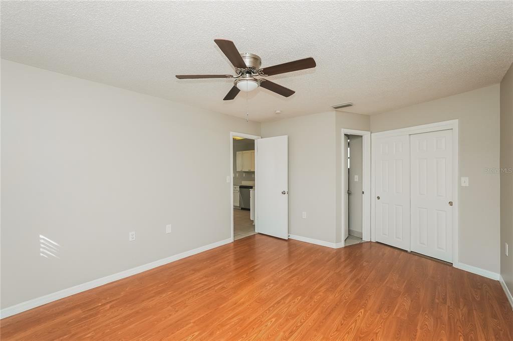 12165 Rockford Street Spring Hill, FL 34608 - Photo 11 of 16 a view of empty room with wooden floor