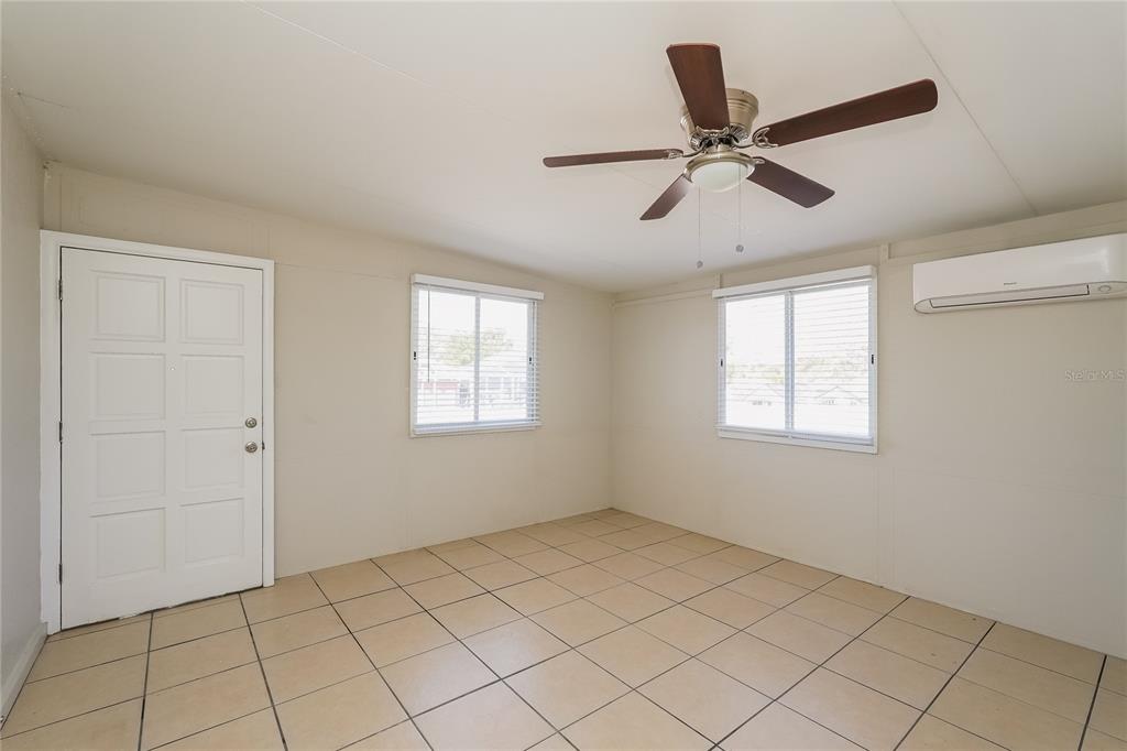 12165 Rockford Street Spring Hill, FL 34608 - Photo 13 of 16 a view of an empty room and window