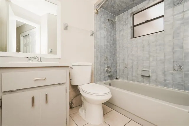 a bathroom with a sink a toilet and a bathtub