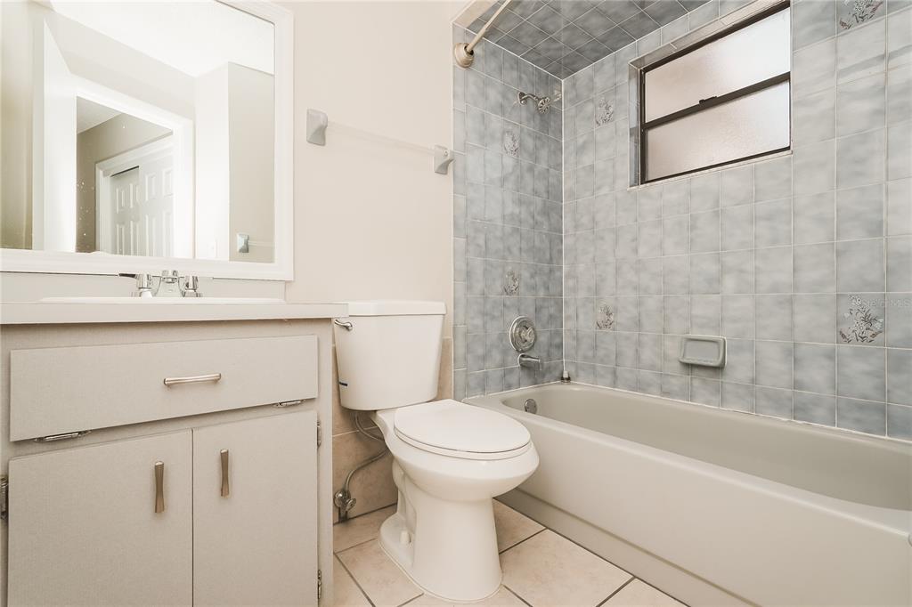 12165 Rockford Street Spring Hill, FL 34608 - Photo 15 of 16 a bathroom with a sink a toilet and a bathtub