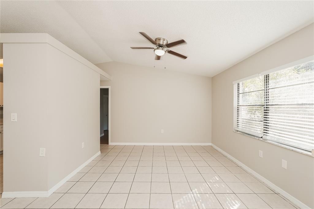 12165 Rockford Street Spring Hill, FL 34608 - Photo 3 of 16 a view of an empty room with a window
