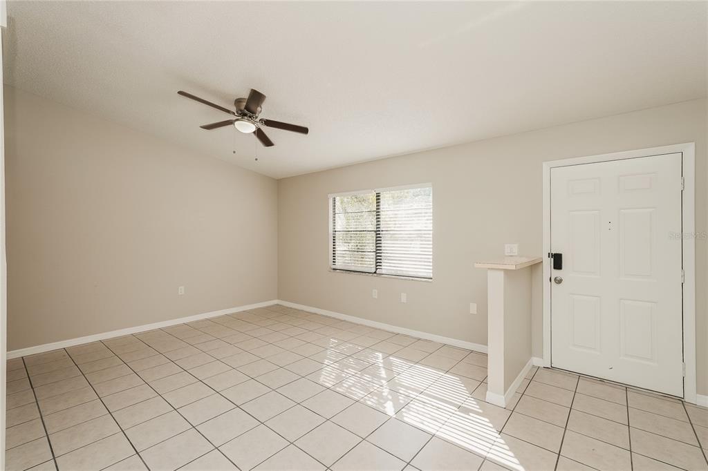 12165 Rockford Street Spring Hill, FL 34608 - Photo 4 of 16 a view of an empty room and window