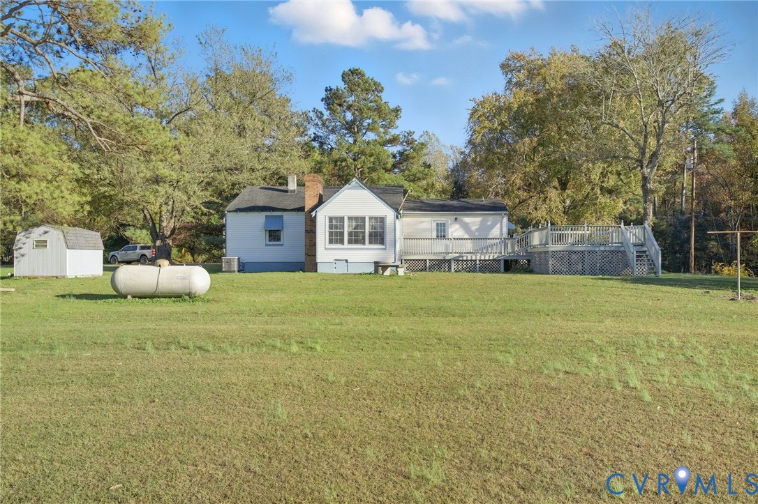 9102 Boydton Plank Road Petersburg, VA 23803 - Photo 23 of 32 a front view of a house with a yard and trees