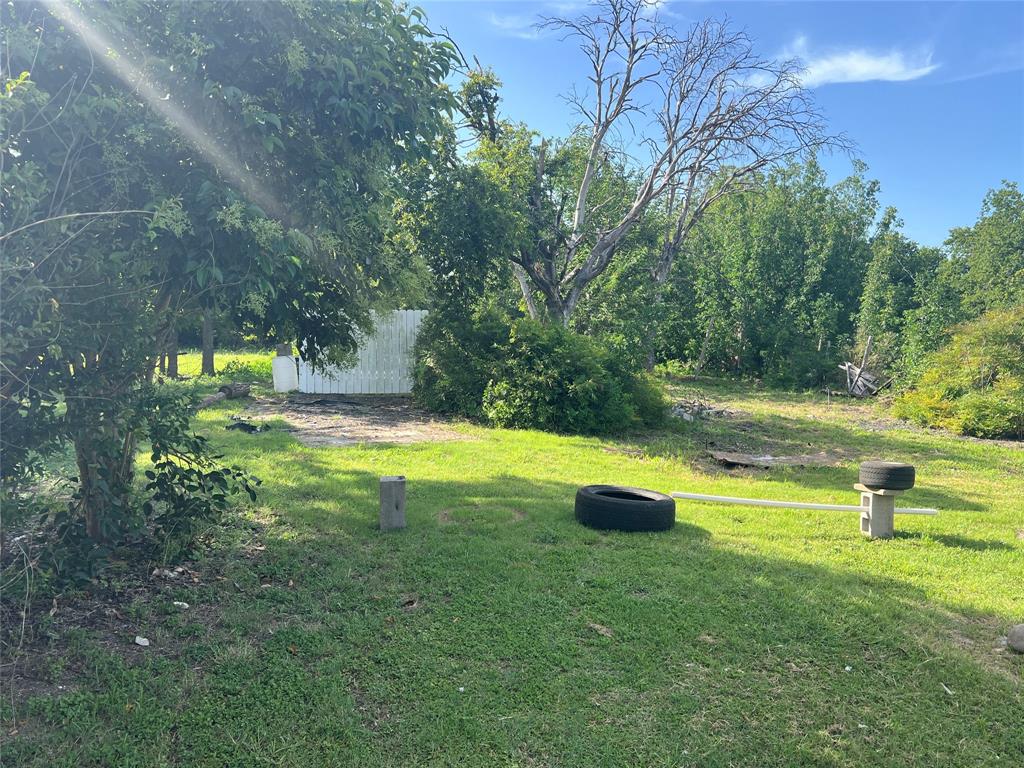 791 Hardeman Street Italy, TX 76651 - Photo 3 of 3 a view of swimming pool with a yard