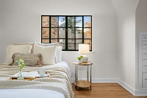 a bedroom with a bed and a window