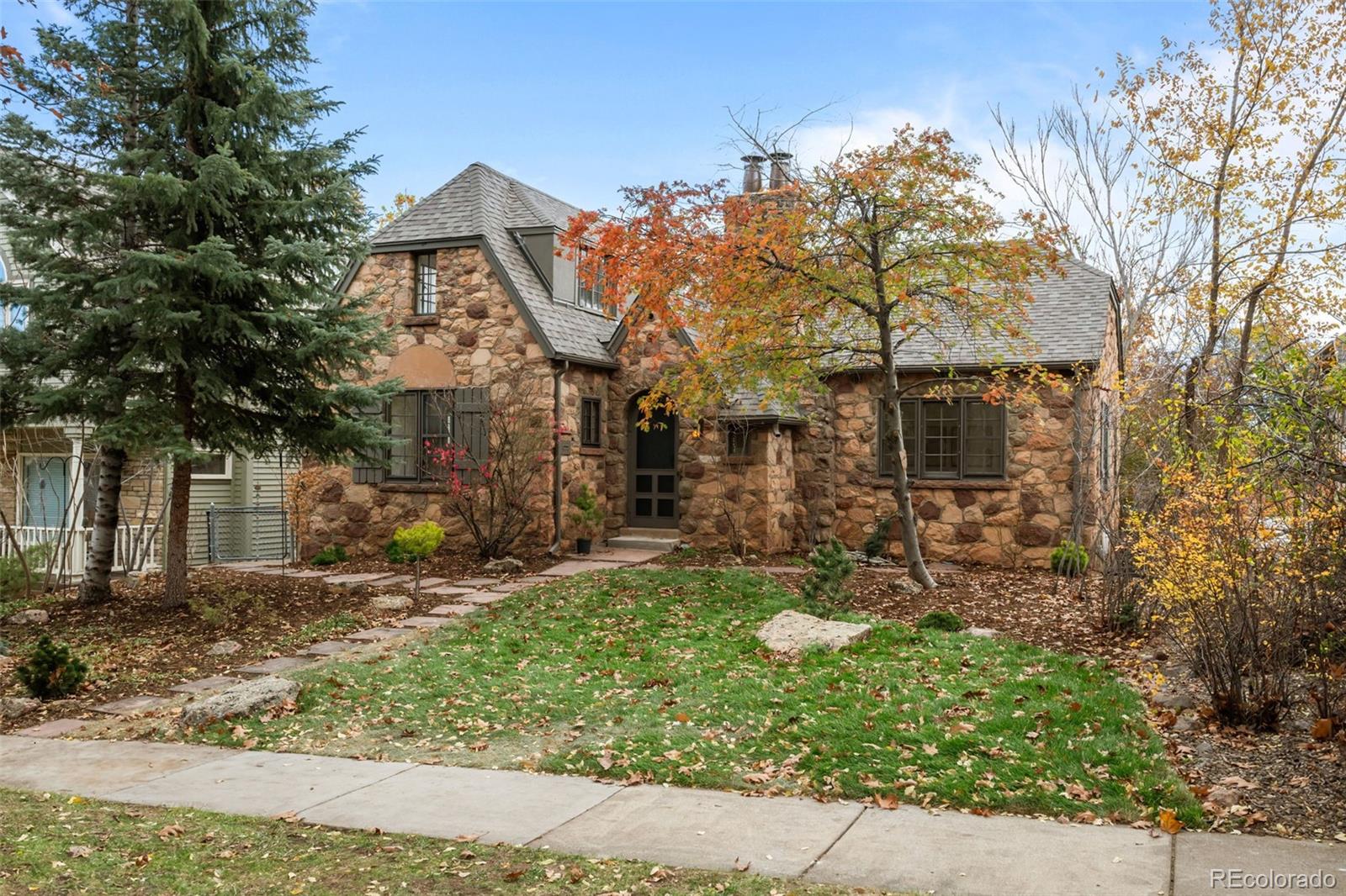 772 16th Street Boulder, CO 80302 - Photo 2 of 26 a front view of a house with garden
