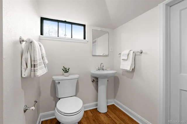 a bathroom with a toilet and a sink