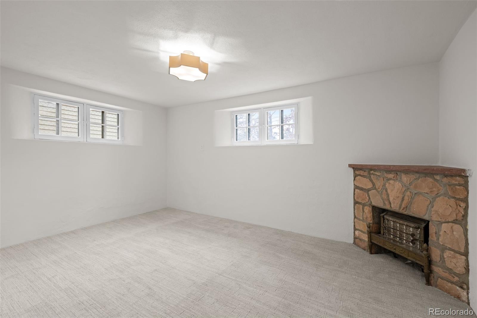 772 16th Street Boulder, CO 80302 - Photo 23 of 26 a view of an empty room with a fireplace