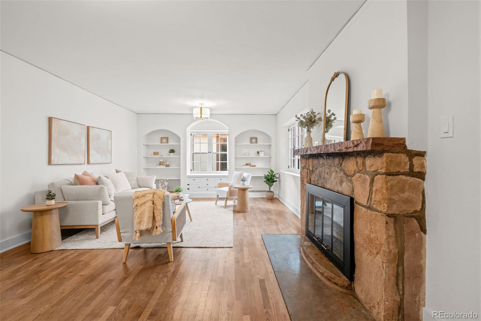 772 16th Street Boulder, CO 80302 - Photo 5 of 26 a living room with furniture a fireplace and wooden floor