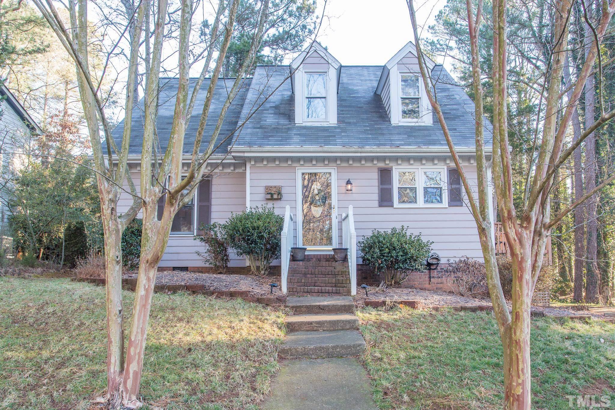 6924 Glendower Road Raleigh, NC 27613 - Photo 1 of 27 a front view of a house with garden