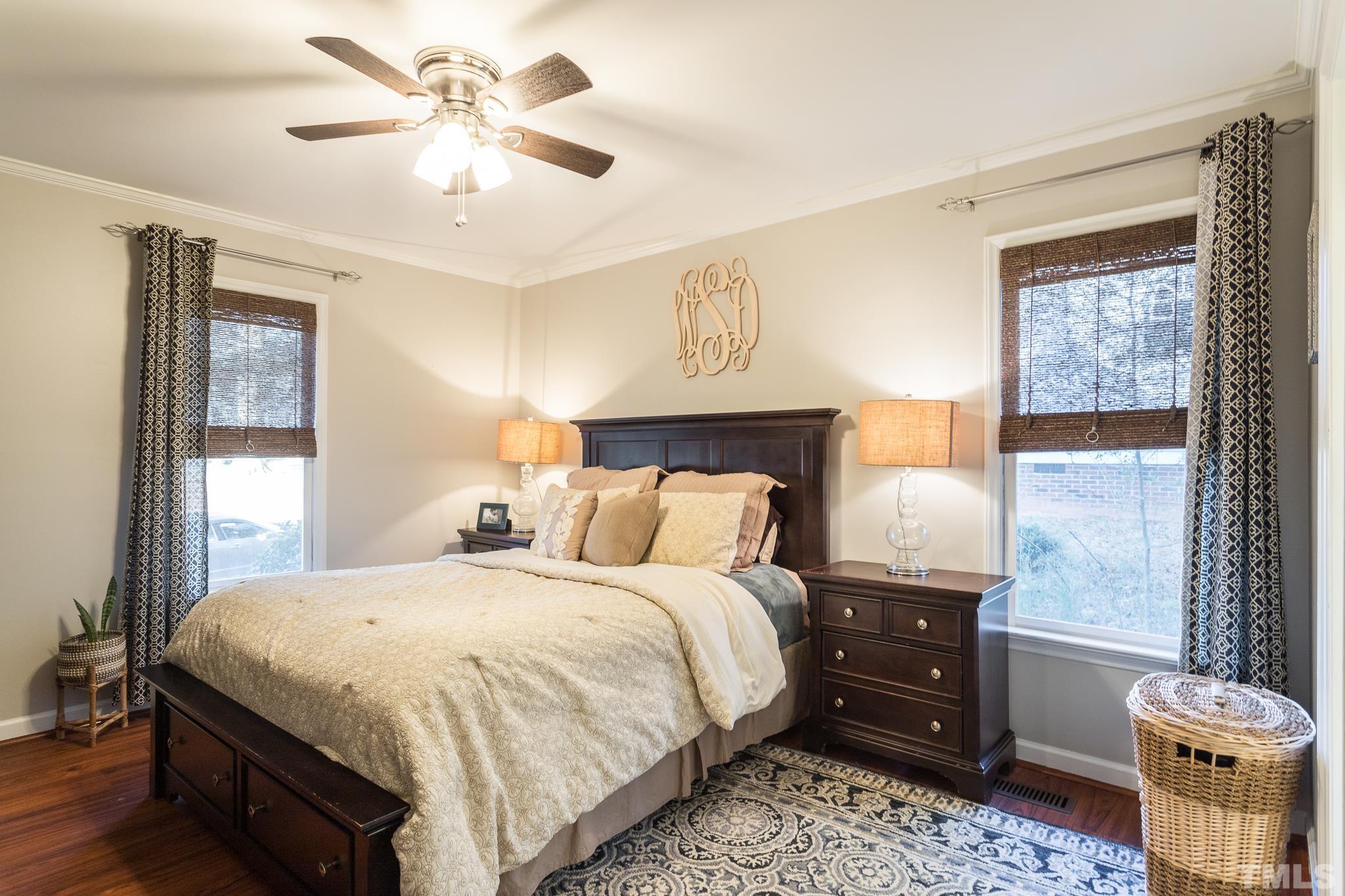 6924 Glendower Road Raleigh, NC 27613 - Photo 12 of 27 a bedroom with a bed and a window