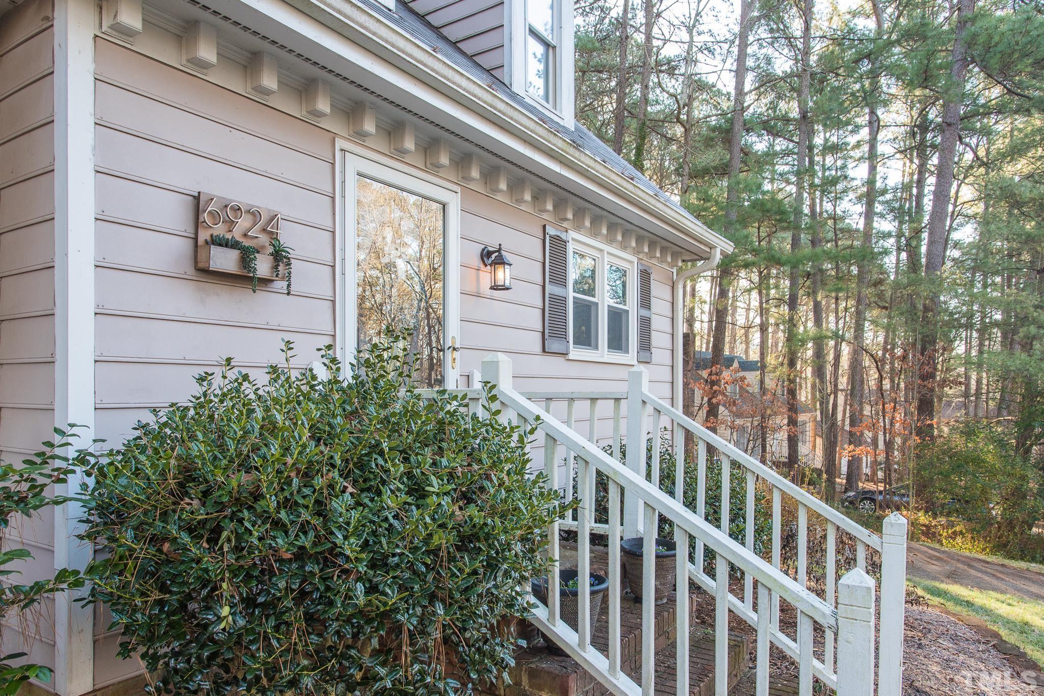 6924 Glendower Road Raleigh, NC 27613 - Photo 2 of 27 a view of a house with balcony and trees