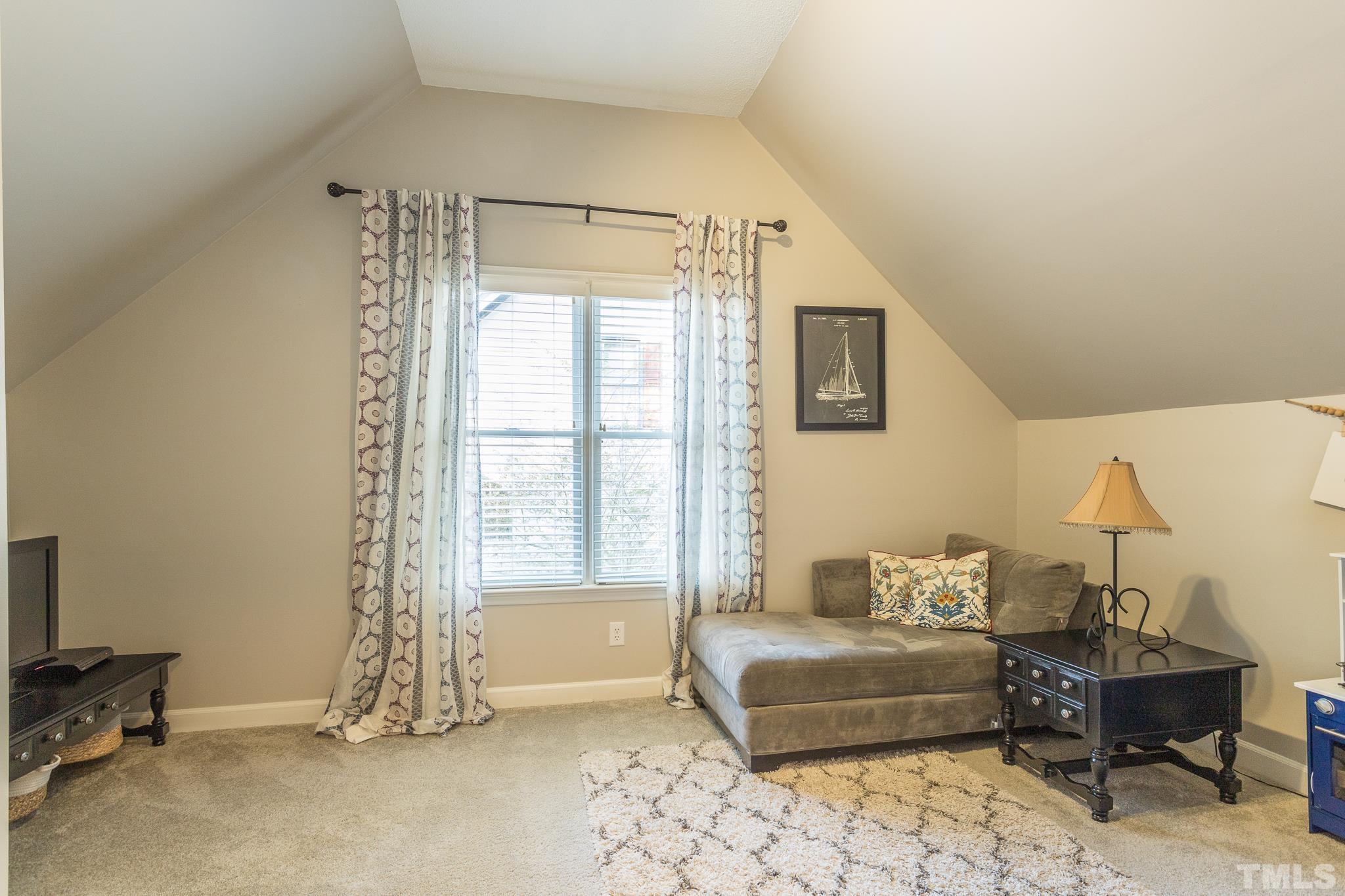 6924 Glendower Road Raleigh, NC 27613 - Photo 21 of 27 a living room with furniture and a window