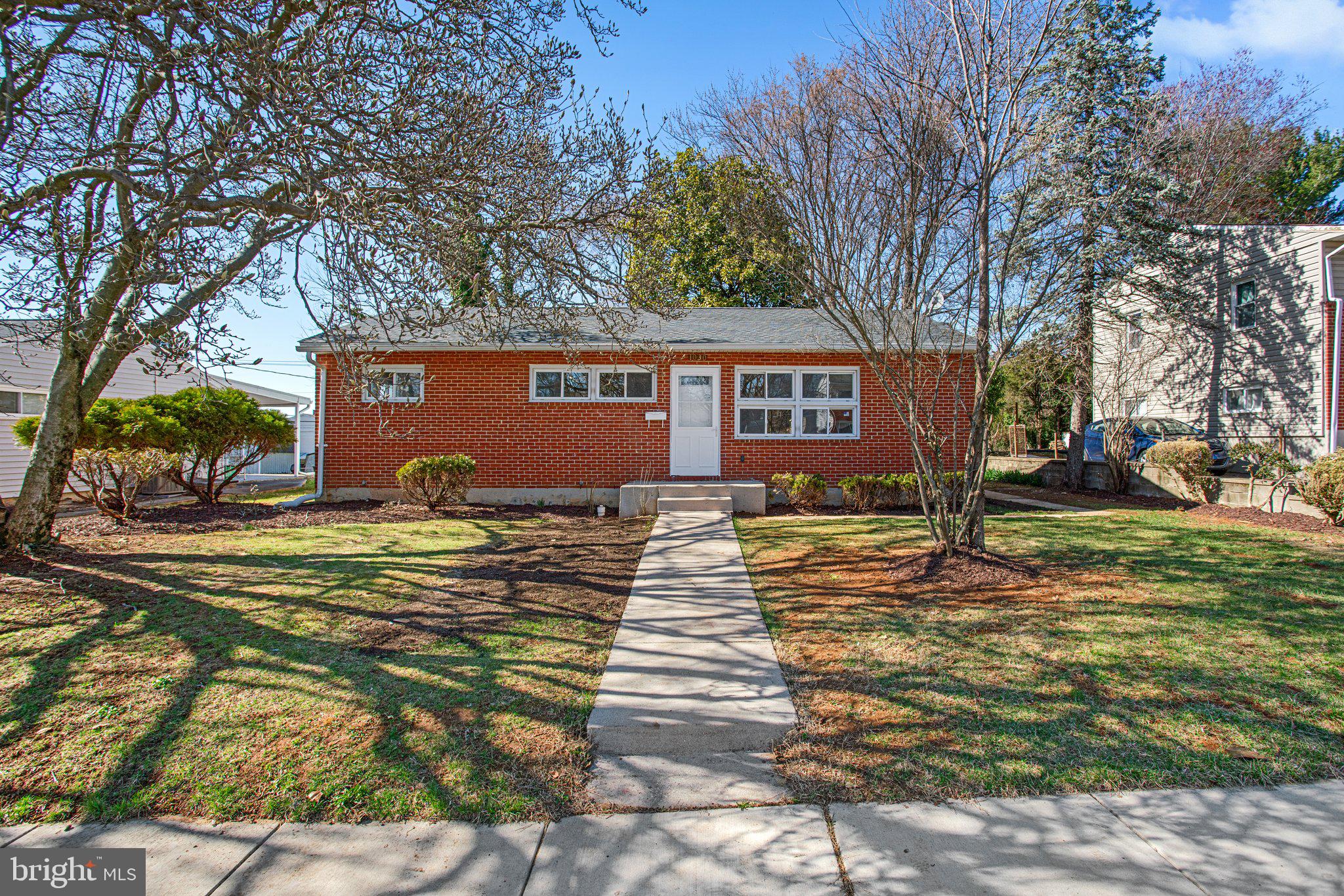 1030 Collwood Road Catonsville, MD 21228 - Photo 1 of 48 a front view of a house with garden
