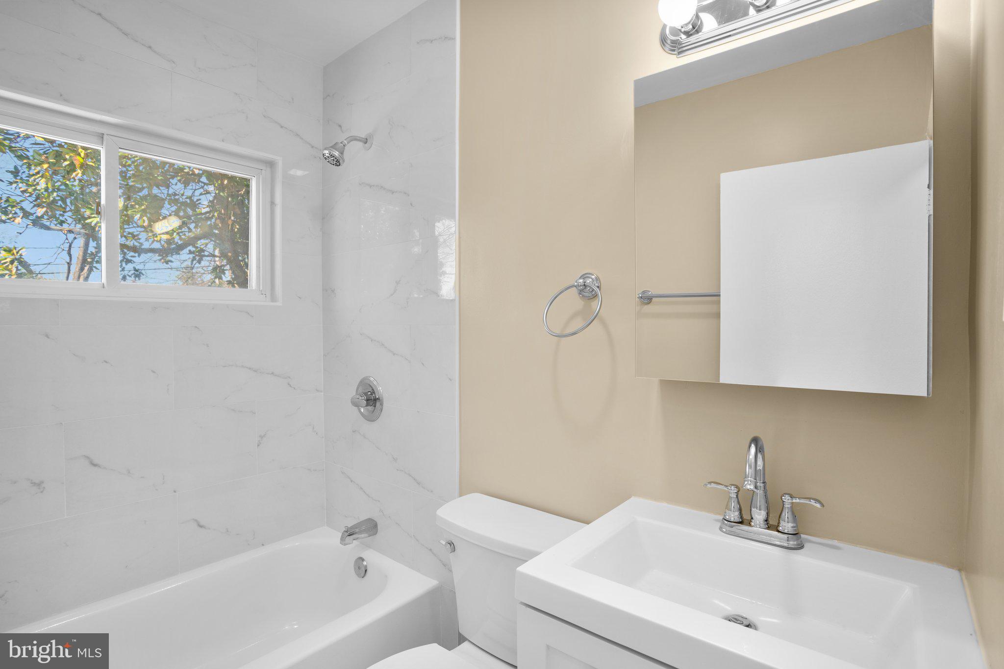 1030 Collwood Road Catonsville, MD 21228 - Photo 18 of 48 a bathroom with a sink a toilet and shower