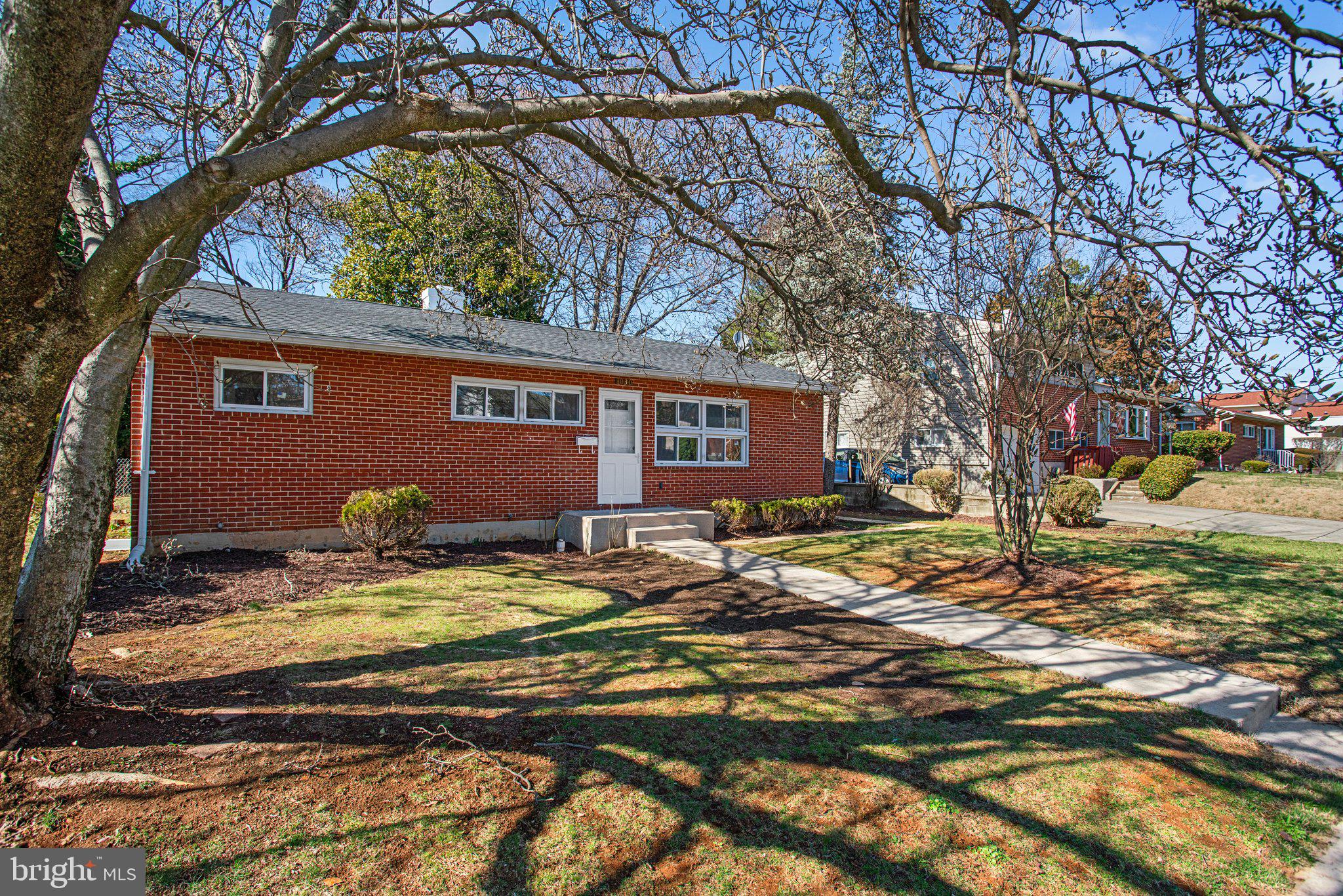 1030 Collwood Road Catonsville, MD 21228 - Photo 2 of 48 a backyard of a house with yard and outdoor seating