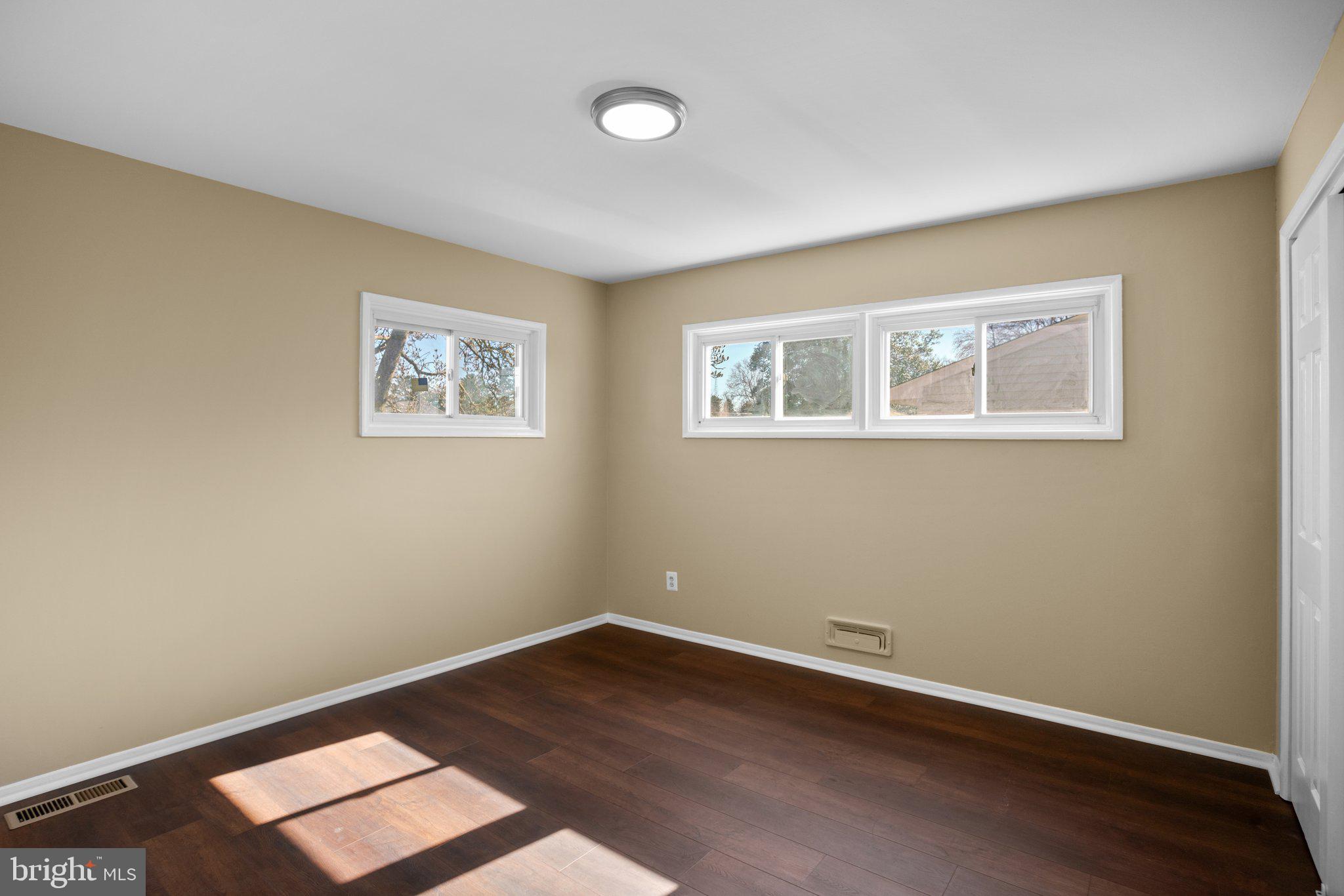 1030 Collwood Road Catonsville, MD 21228 - Photo 23 of 48 a view of a room with wooden floor and window
