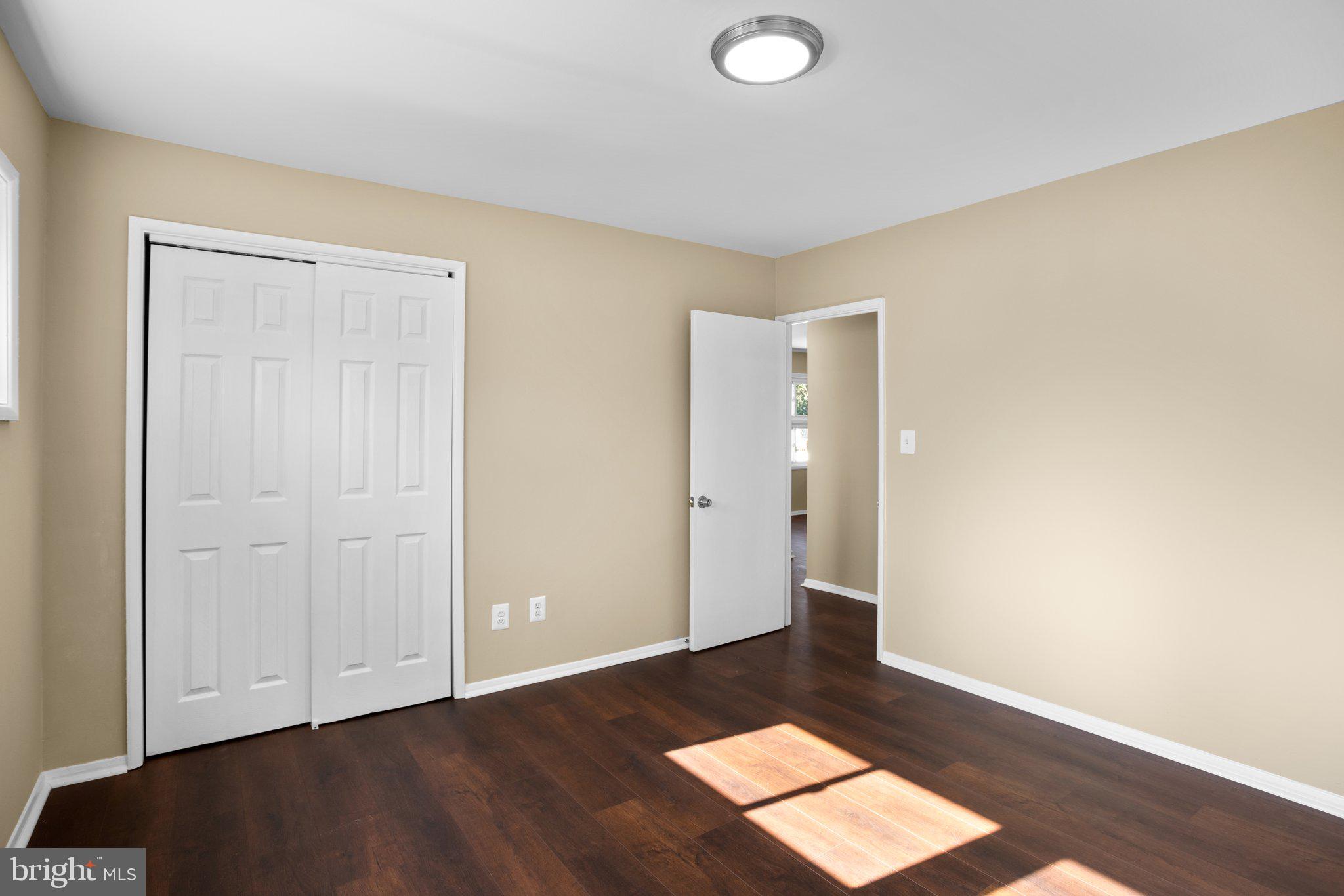 1030 Collwood Road Catonsville, MD 21228 - Photo 24 of 48 an empty room with wooden floor