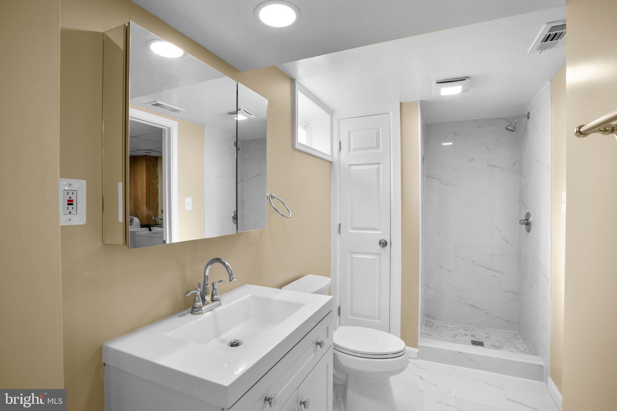 1030 Collwood Road Catonsville, MD 21228 - Photo 36 of 48 a bathroom with a sink toilet and shower