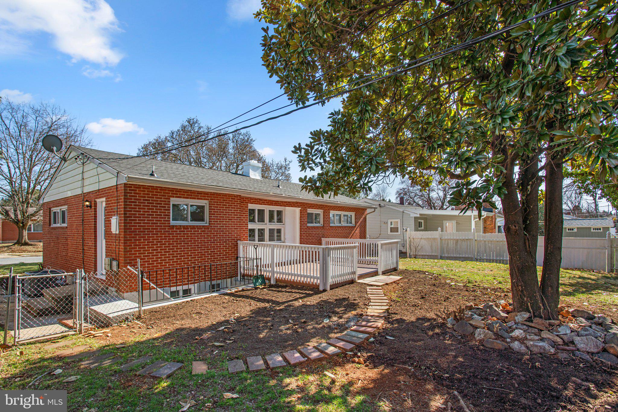1030 Collwood Road Catonsville, MD 21228 - Photo 45 of 48 a backyard of a house with barbeque oven and outdoor seating