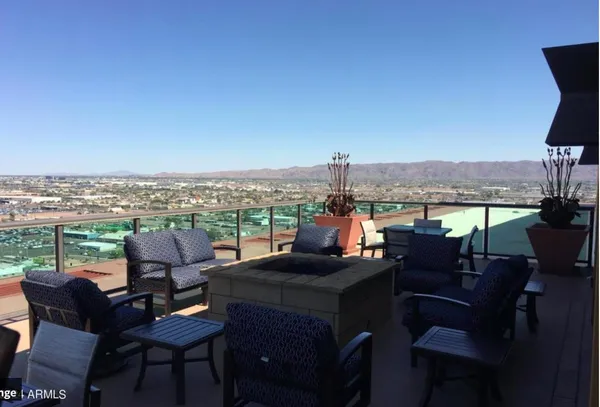 a view of a terrace with furniture