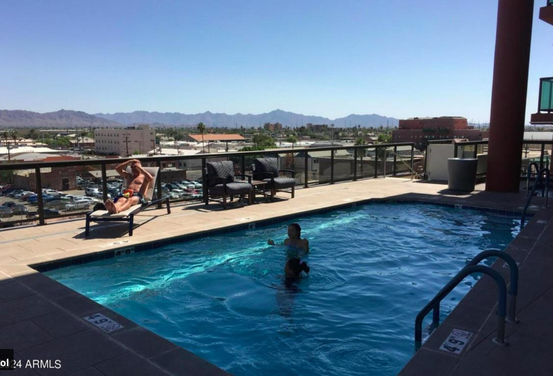 310 South 4th Street, Unit 1602 Phoenix, AZ 85004 - Photo 16 of 20 a view of a swimming pool with lounge chair