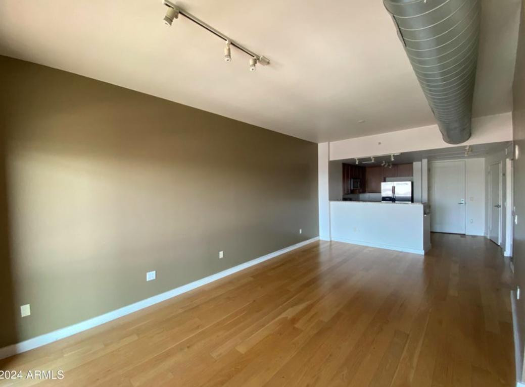 310 South 4th Street, Unit 1602 Phoenix, AZ 85004 - Photo 2 of 20 a view of a hallway with wooden floor