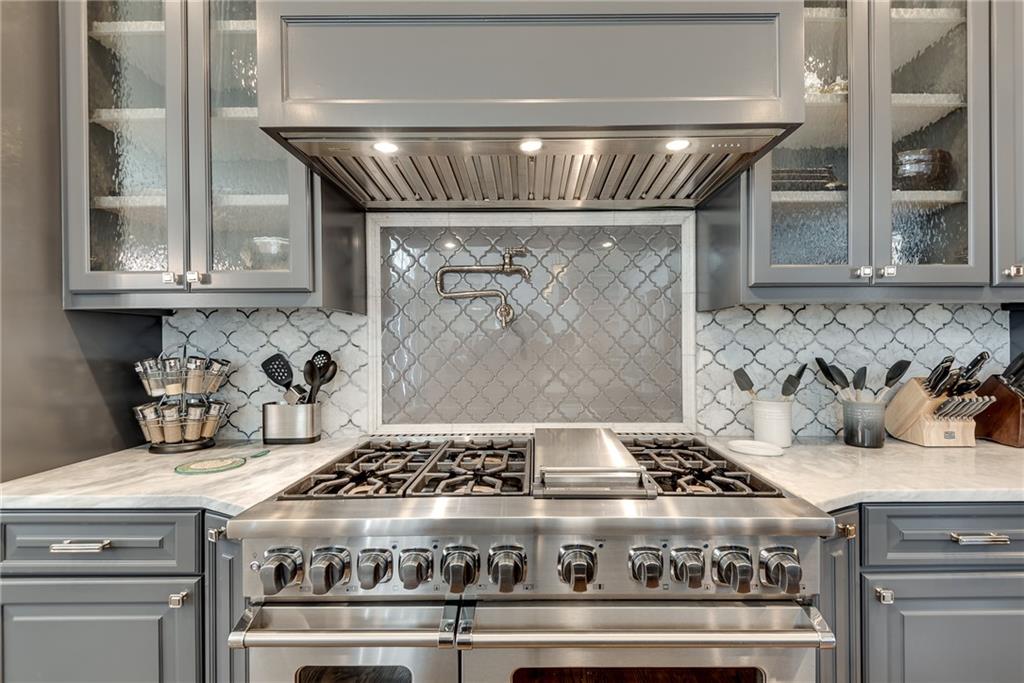 187 Fontaine Road Southwest Mableton, GA 30126 - Photo 24 of 84 a stove sitting inside of a kitchen with white cabinets