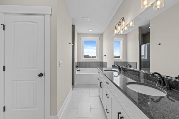 5558 Borthick Road Springfield, TN 37172 - Photo 23 of 43 a bathroom with a granite countertop double vanity sink mirror and